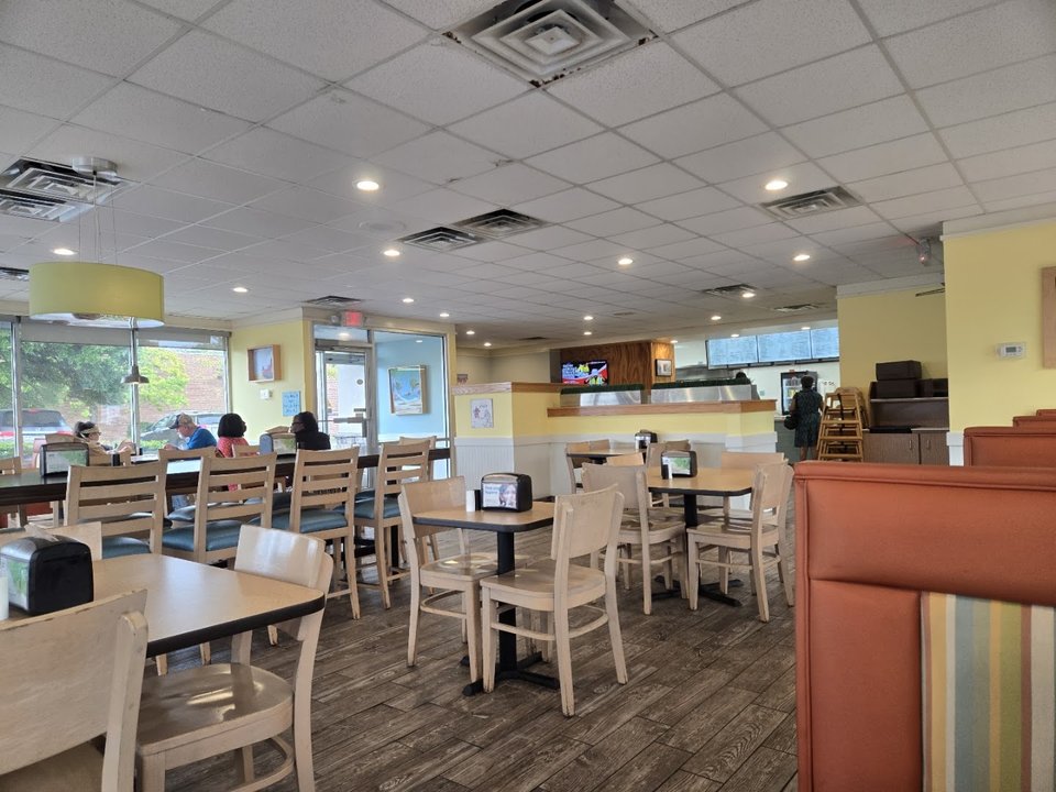 Counter service area with trays of comfort food.