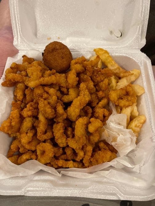 Printed menu with fried chicken and shrimp options.